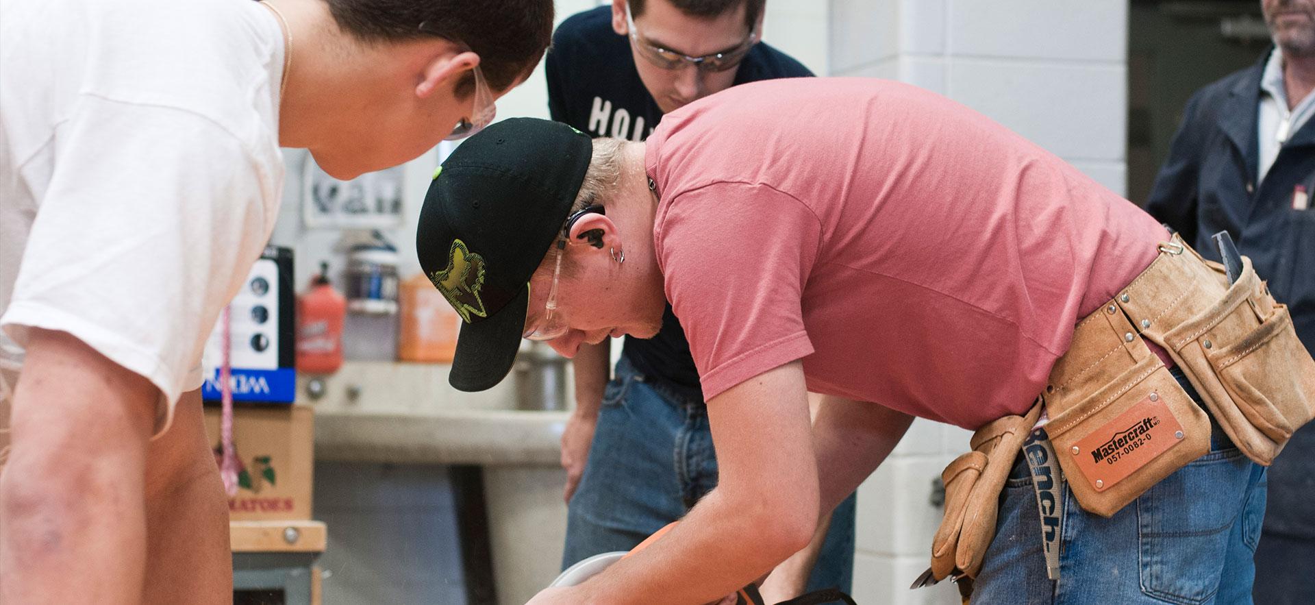 Student cutting lumber with skill saw