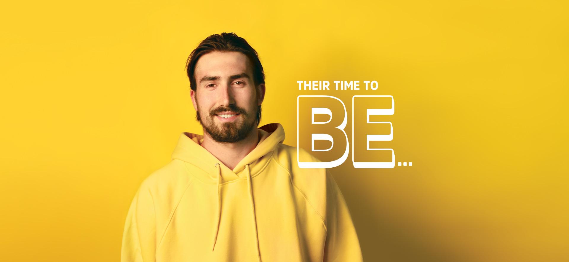 Deep Dive image with student in yellow hoodie with yellow background smiling at camera with text THEIR TIME TO BE