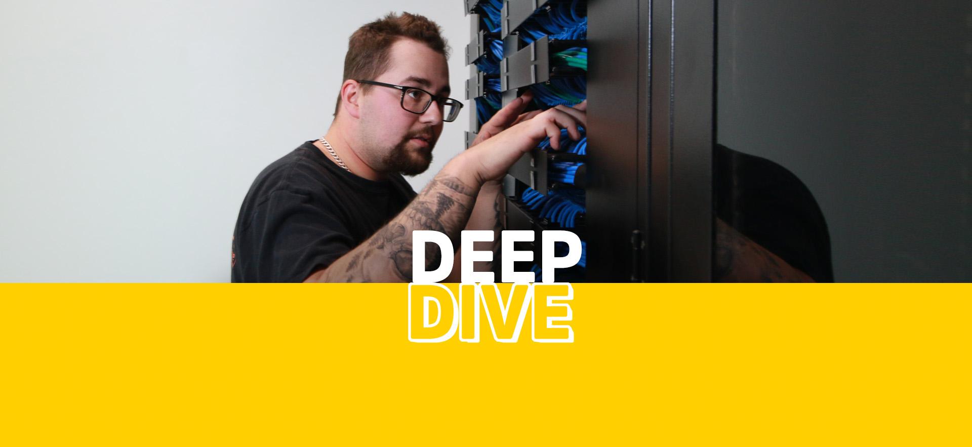 Deep Dive IT student working on server