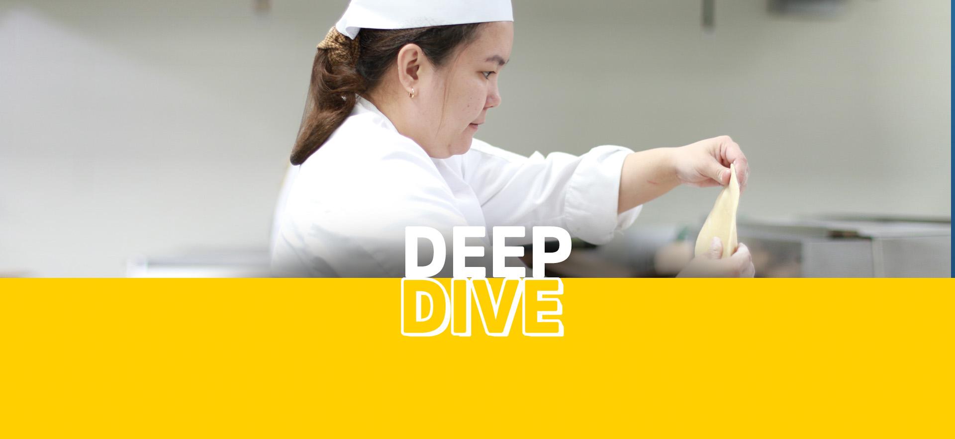 Deep Dive Culinary showing student in kitchen prepping