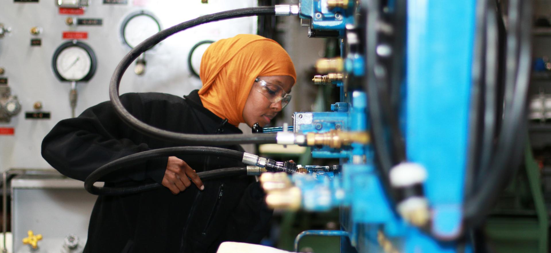 Mechanical Engineering Technology student working in the lab