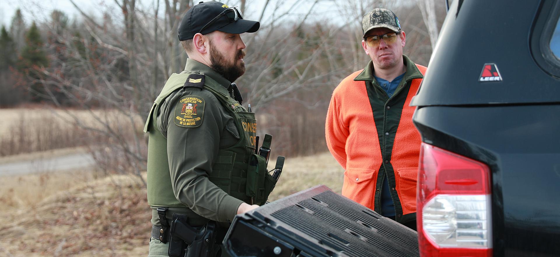 Natural Resource Environmental law instructor performing inspection of hunter