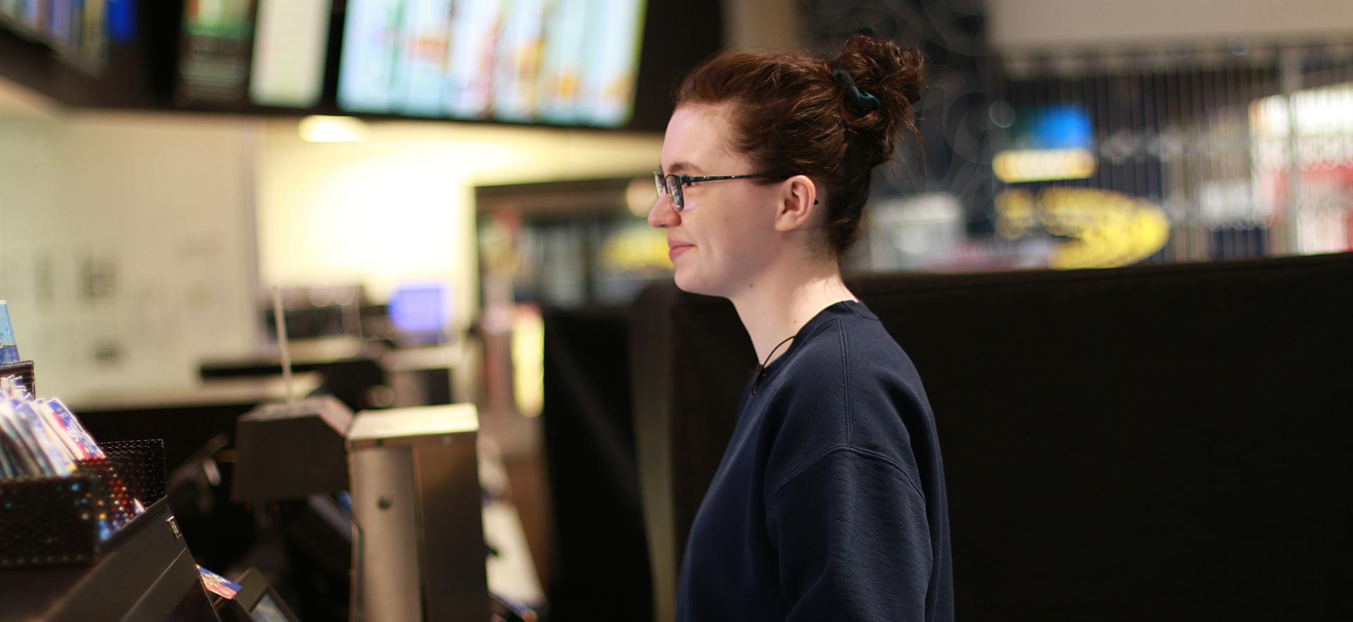 Alison graduate of Digital Film Program at the checkout at Galaxy Cinemas