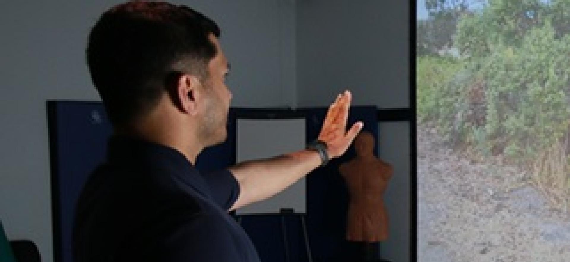 Policing student in the sim lab interacting with simulation scenario on screen