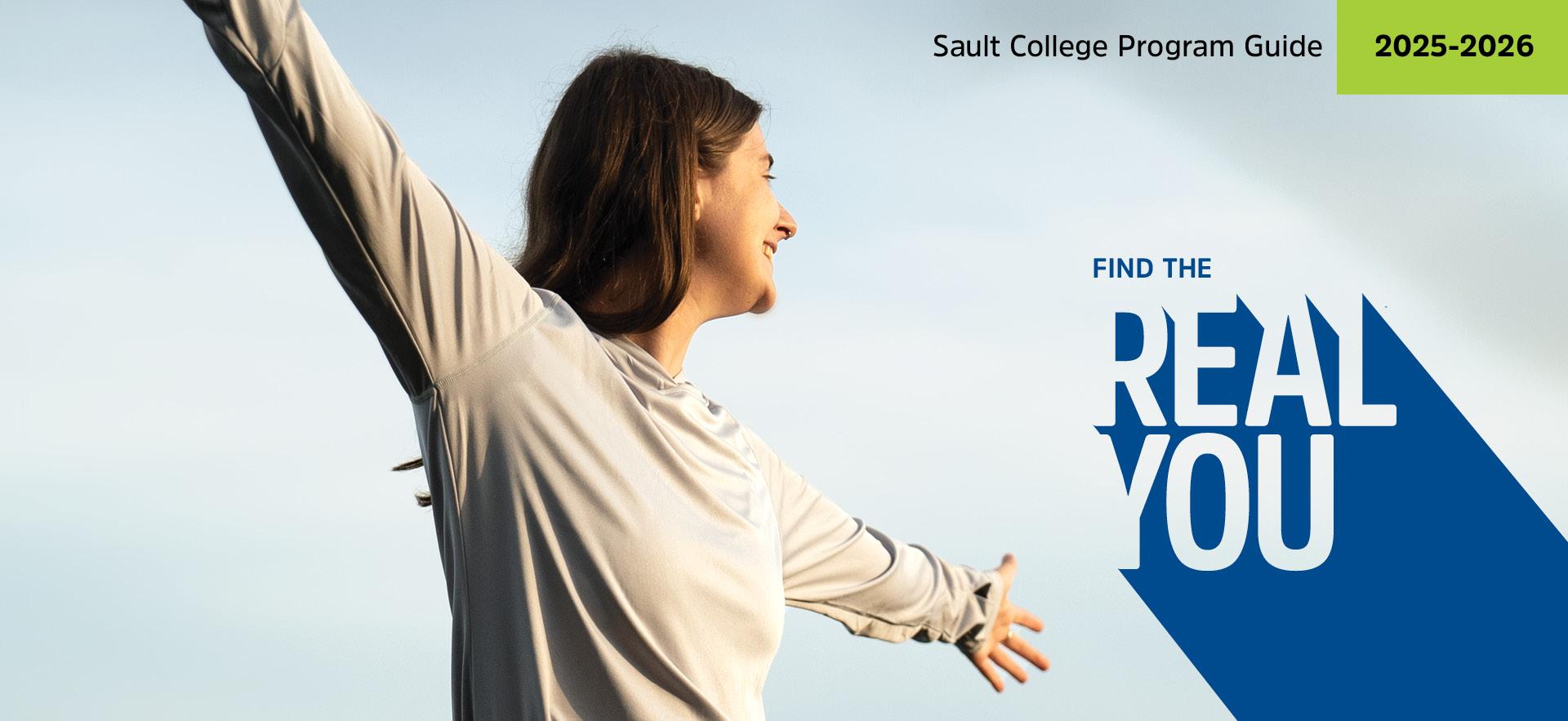 Student with arms spread happy and looking out at the sky