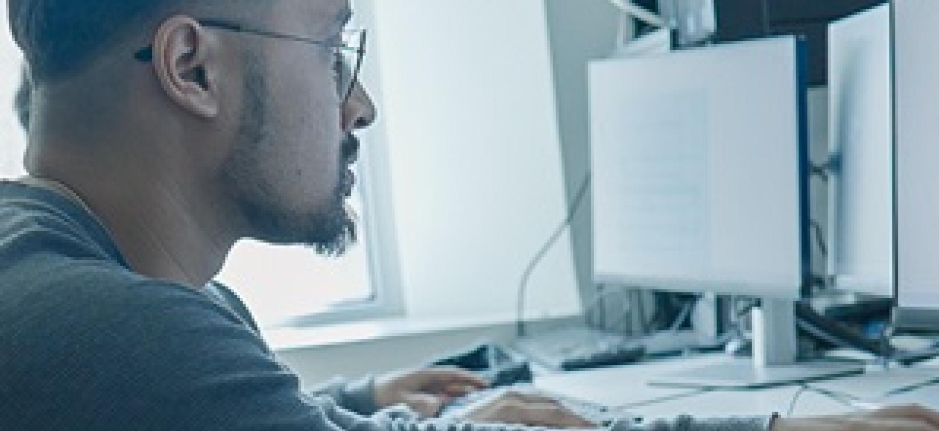 IT student in lab working on the computer