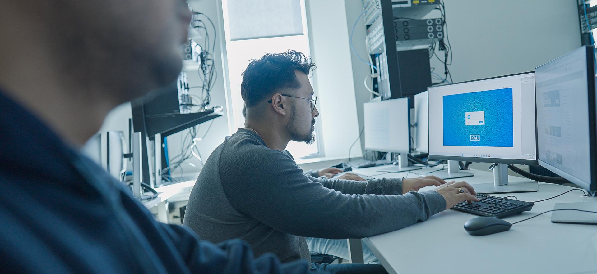 IT students in lab working on the computer