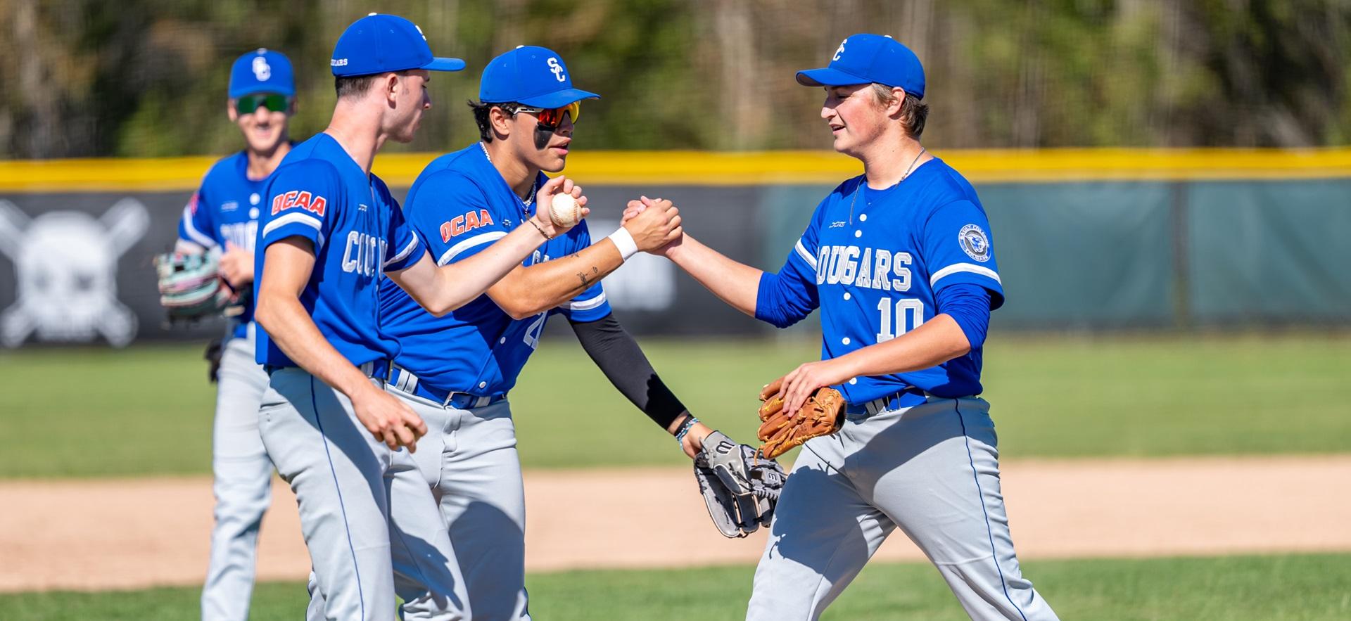 Baseball players shaking hands to celebrate