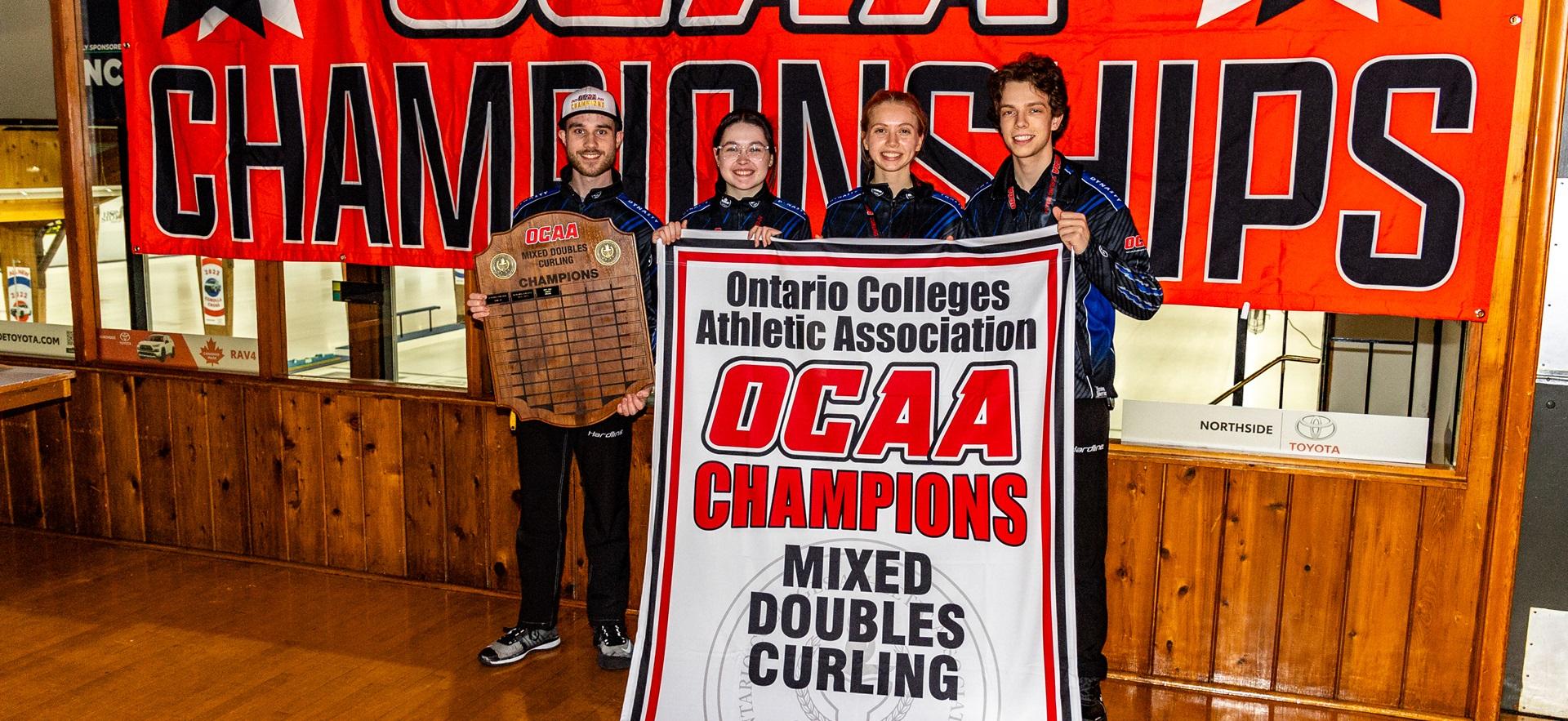 Curling mixed doubles team posing with OCAA Champions banner