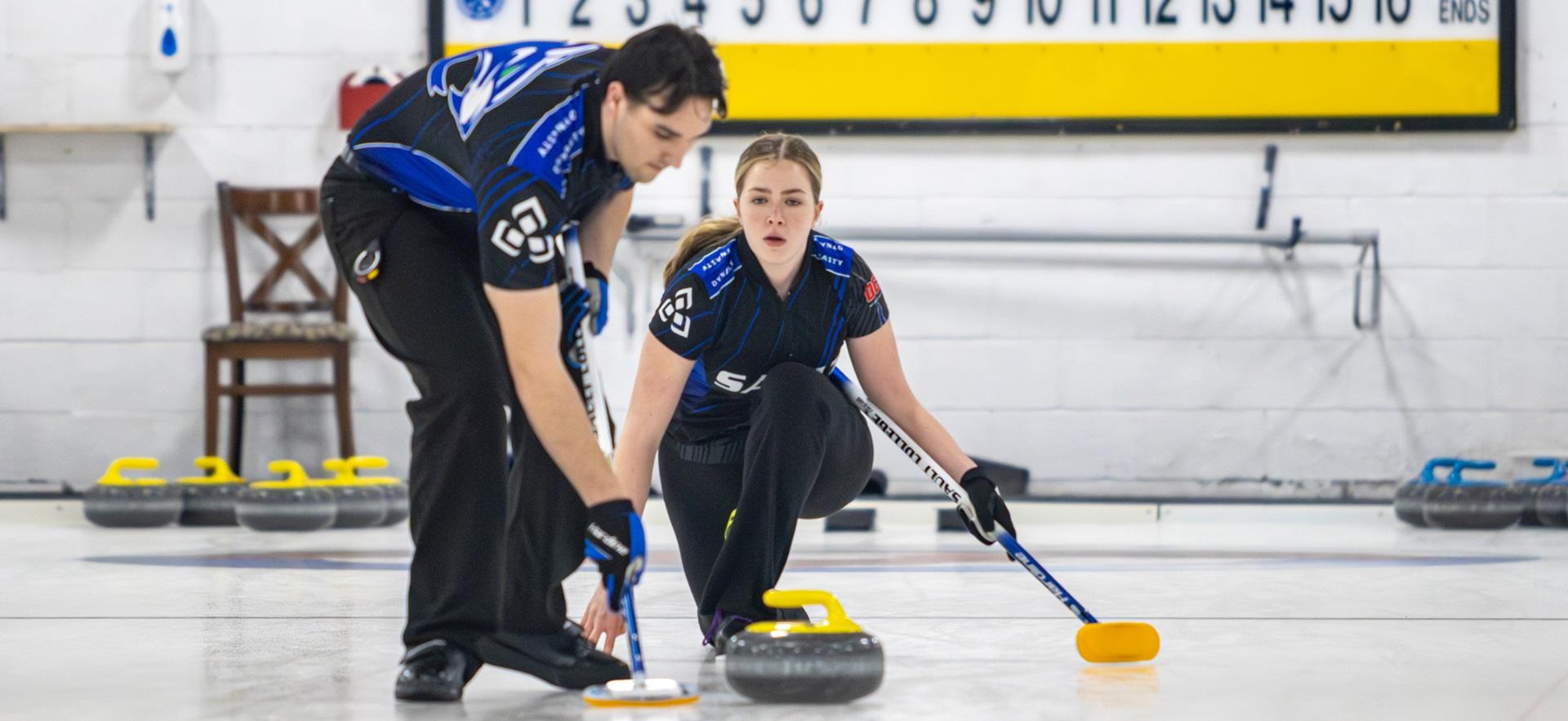 Curling members playing