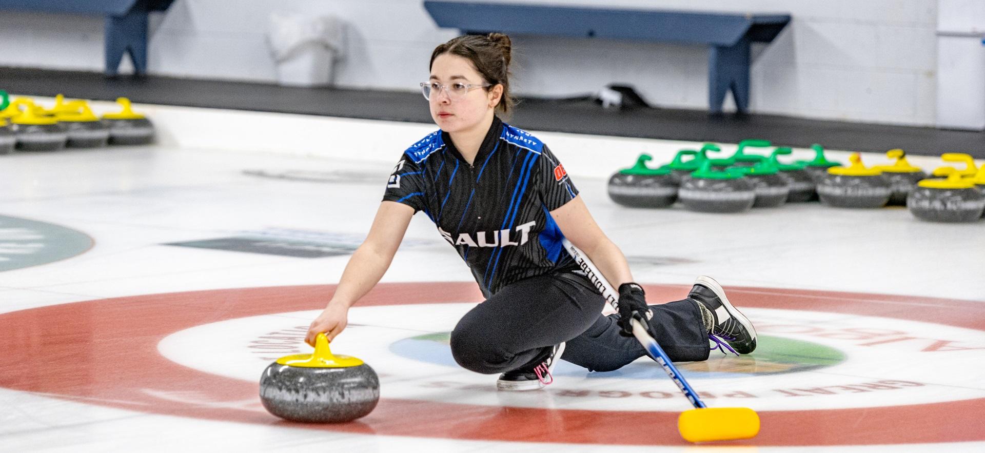 Curling team member playing