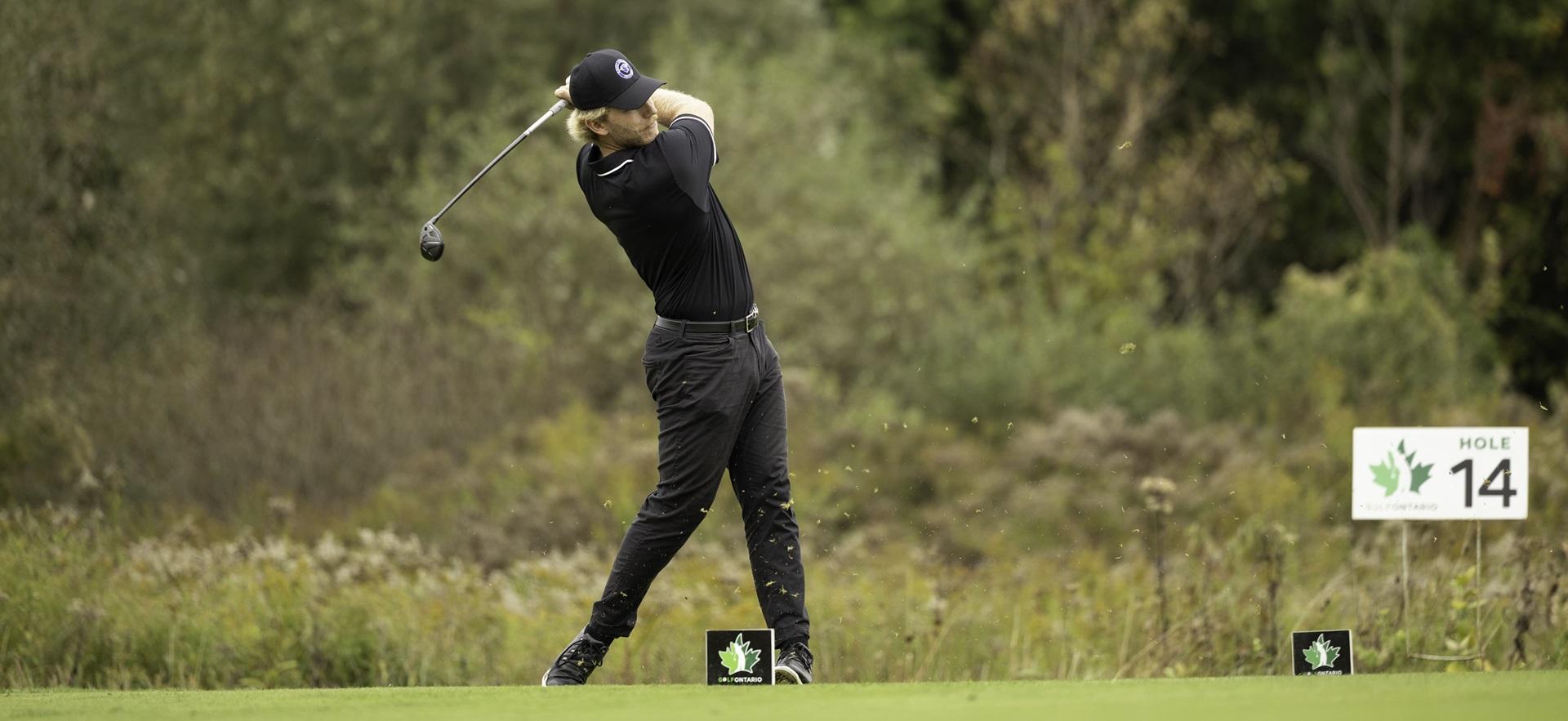 Golf player swinging his club
