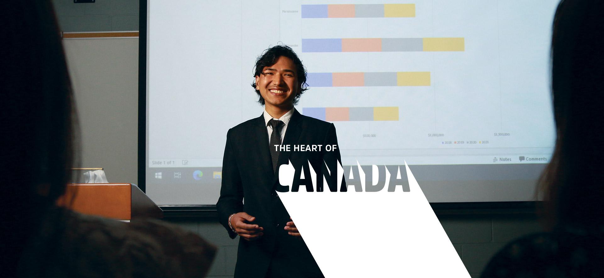 Student presernting in front of projector and screen 