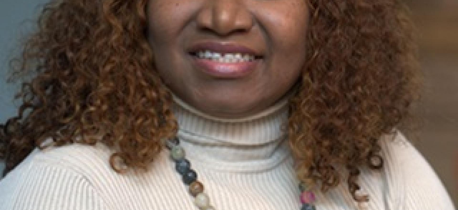 International student posed and smiling at the camera