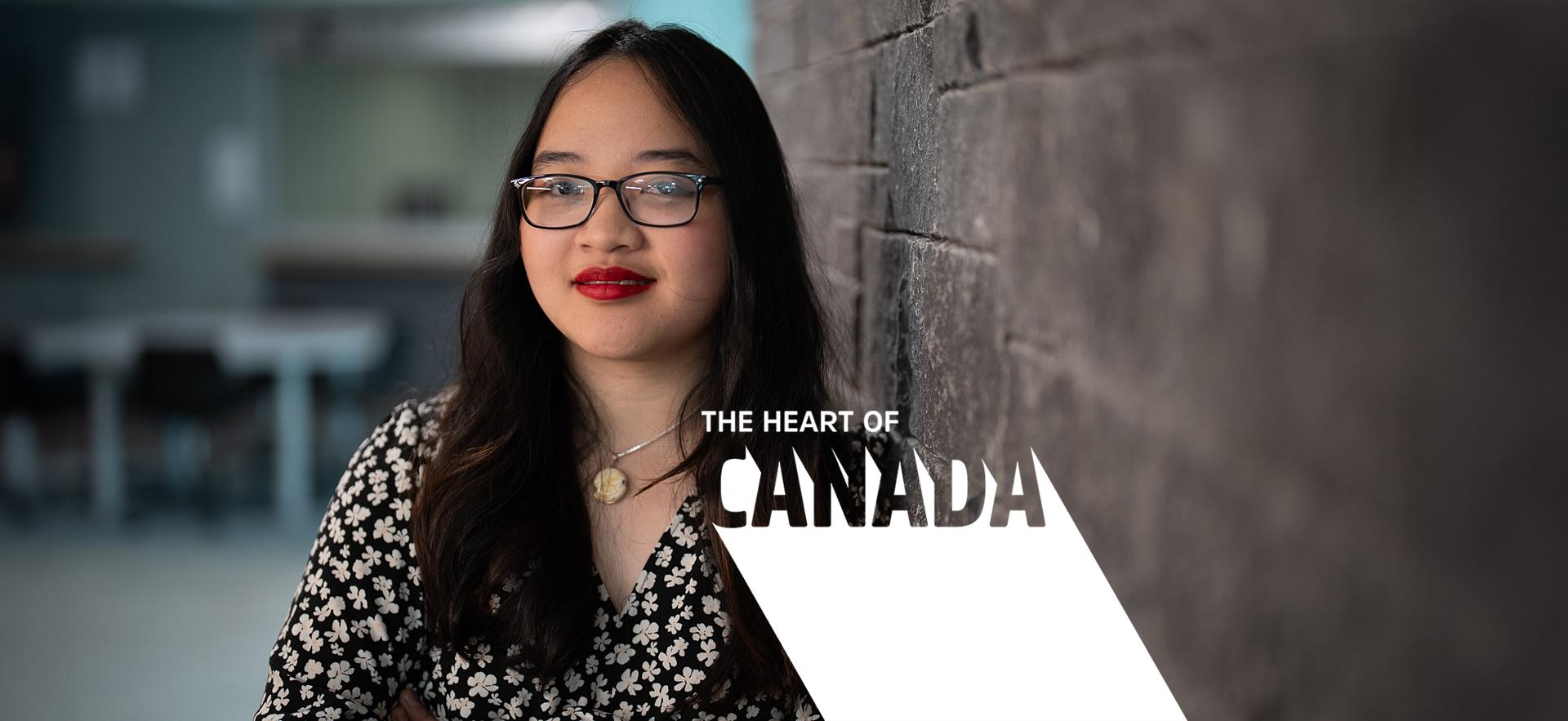 International student posed and smiling at the camera