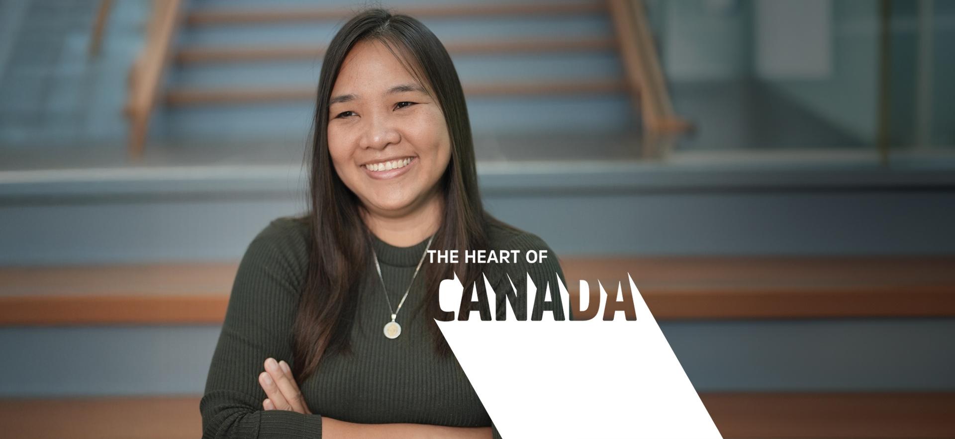 International student posed and smiling at the camera