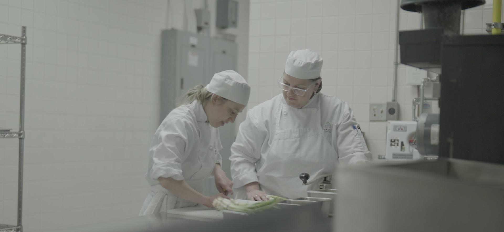 CICE student working in the culinary lab with staff