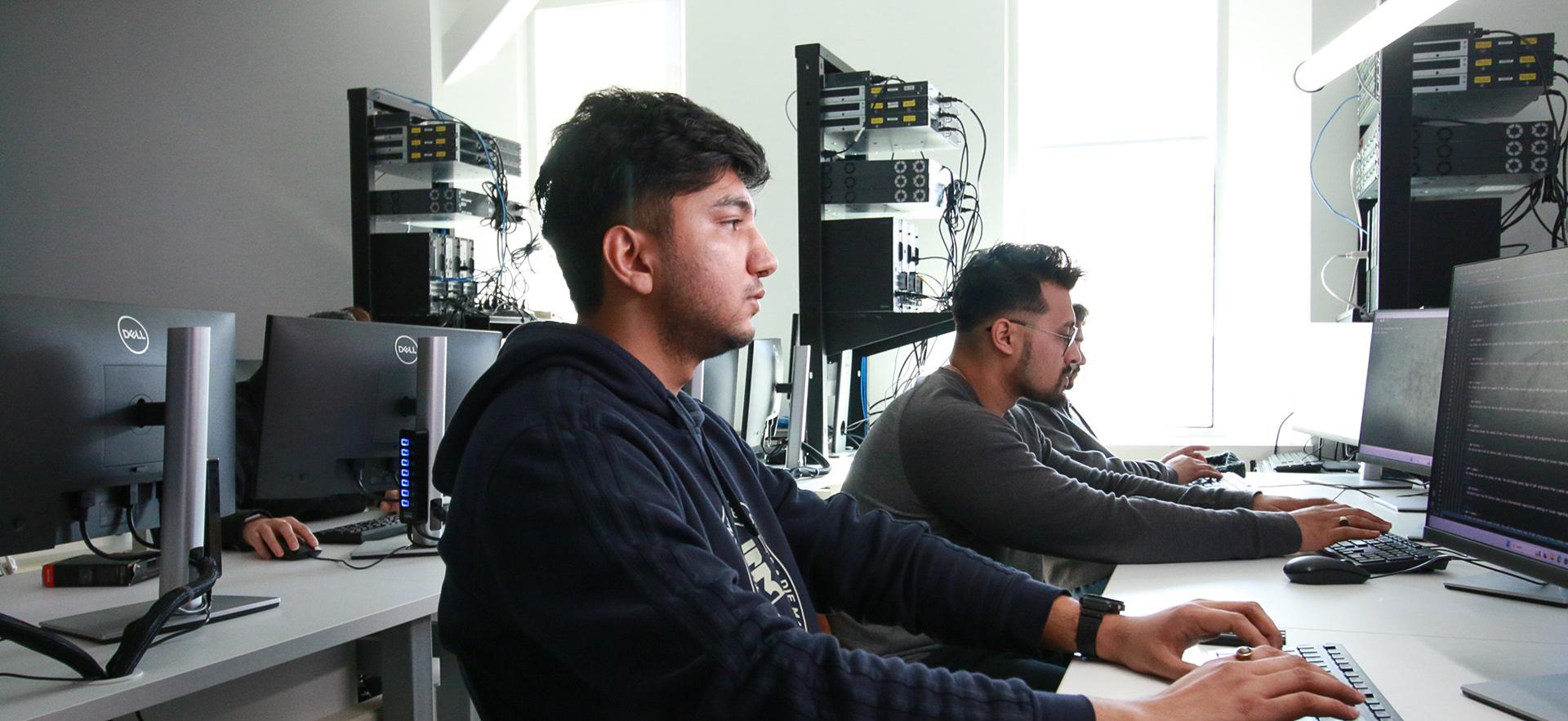 IT students in lab working on the computer