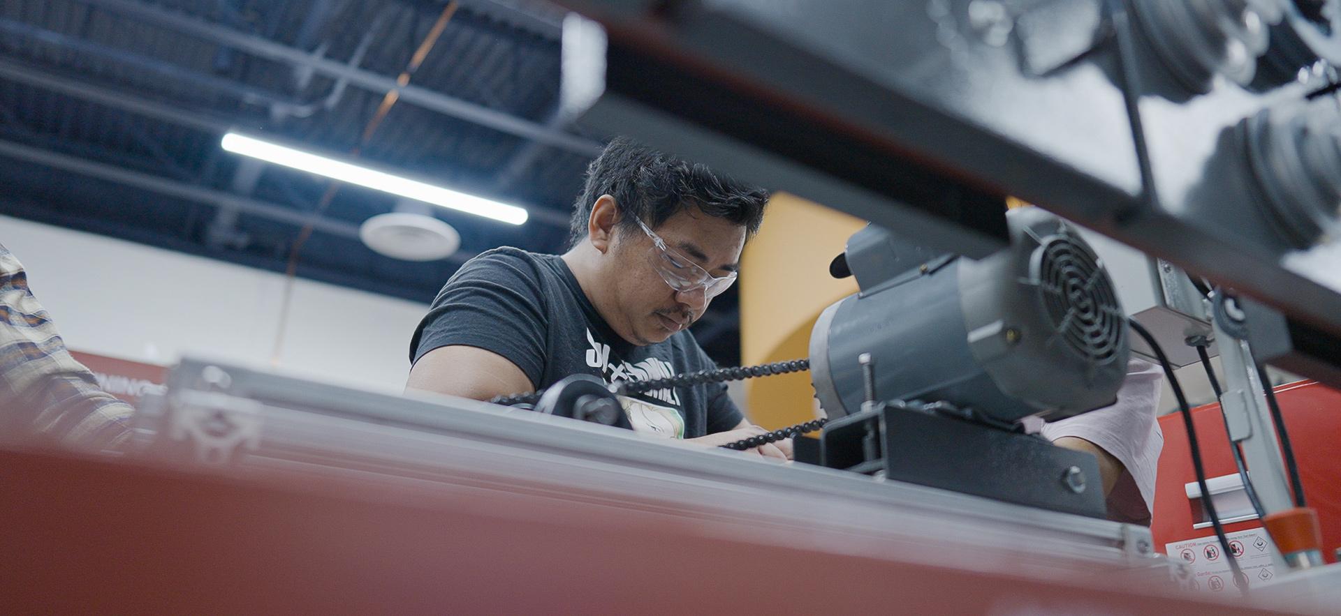 Mechanical Engineering student working with equipment in the lab