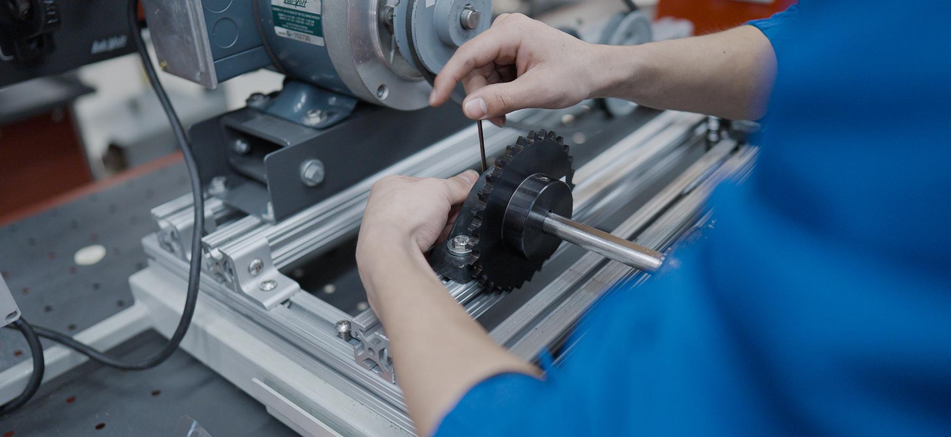 Mechanical Engineering student working with equipment in the lab