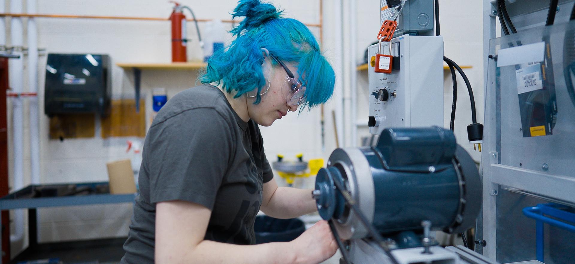 Mechanical Engineering student working with equipment in the lab