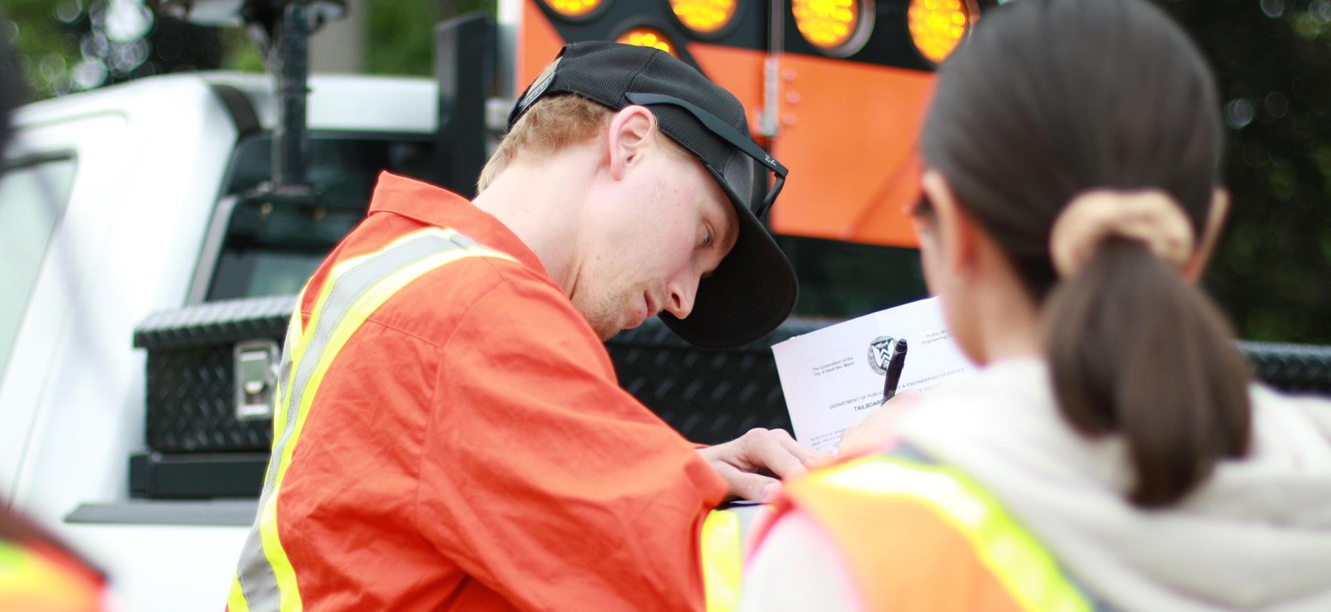 Civil Engineering student speaking to co-op employer filling out paperwork