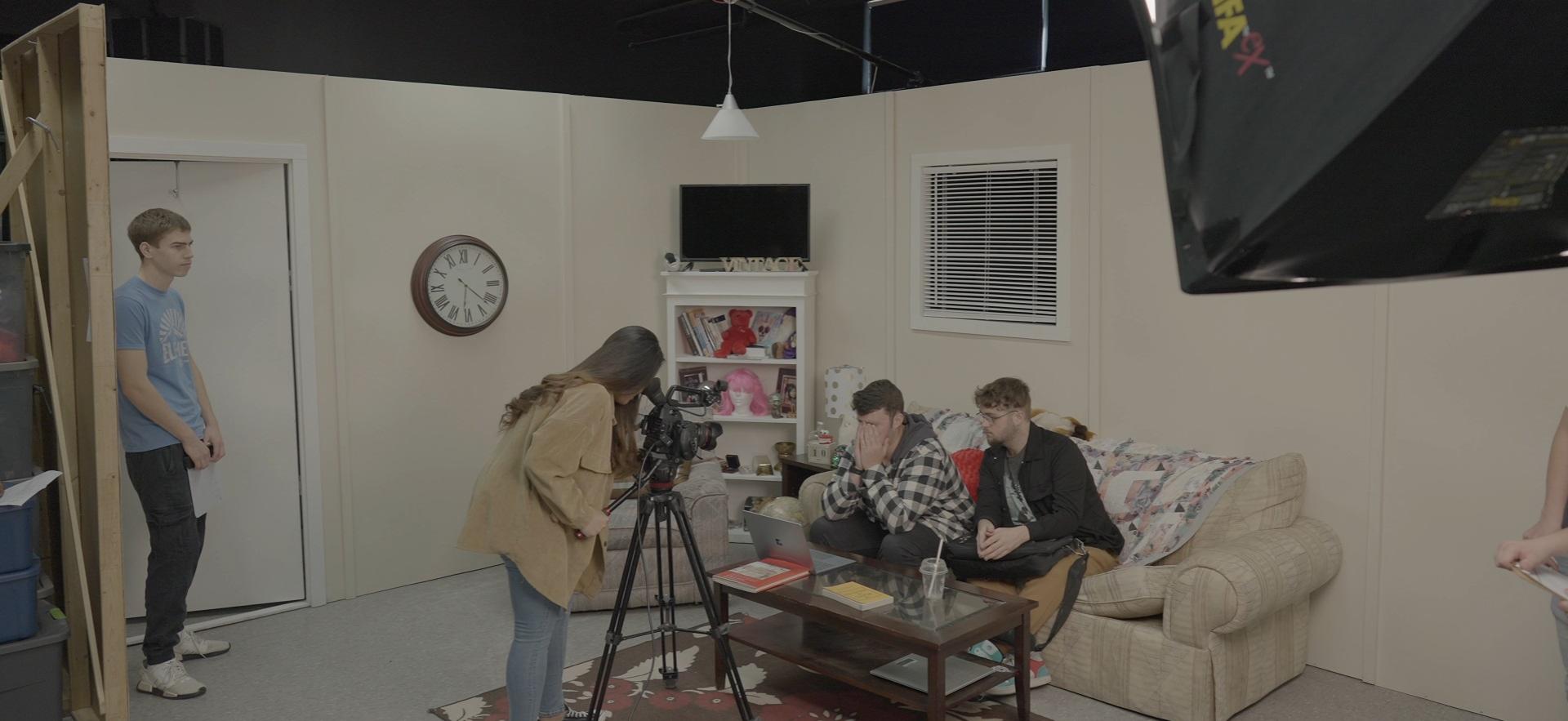 Film students shown on set with student recording, students acting, etc.
