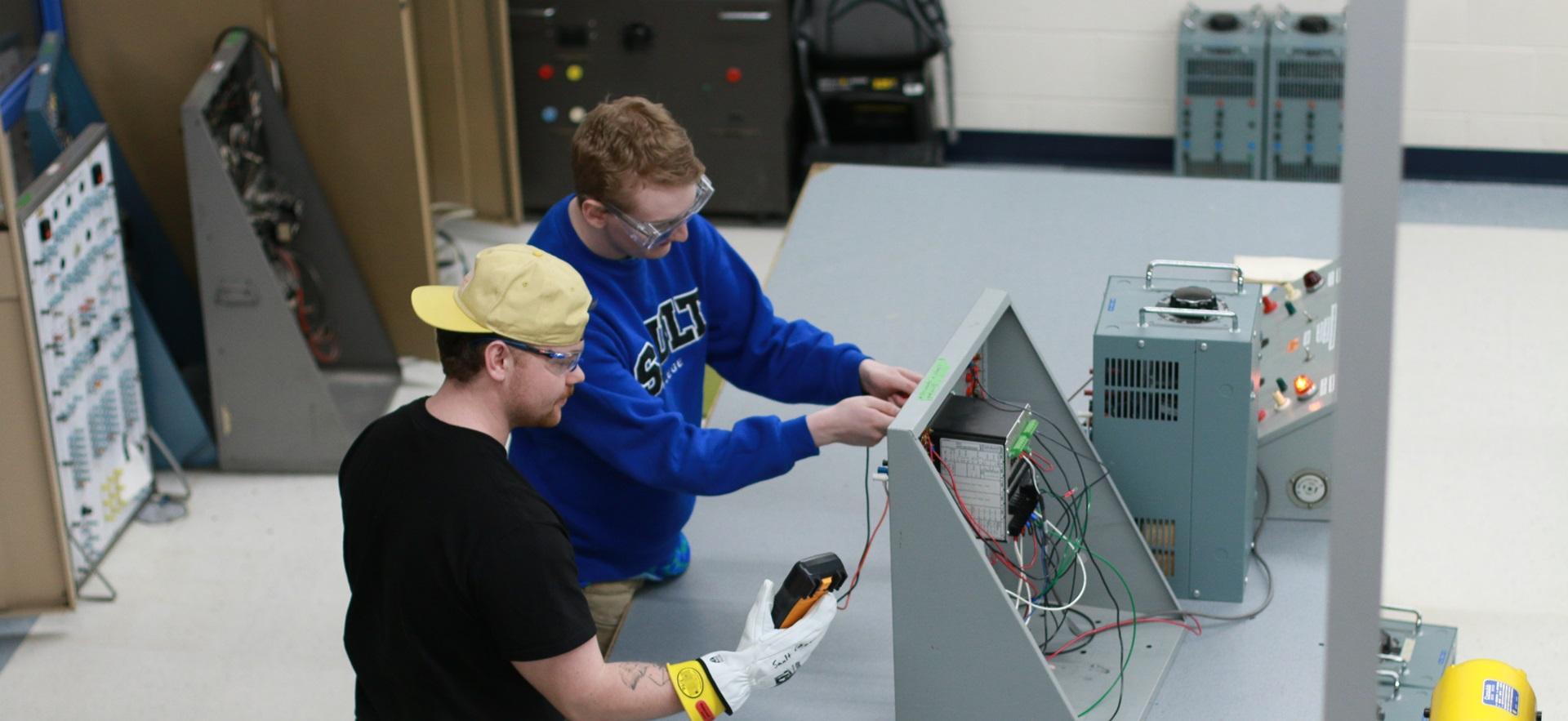 Electrical Engineering students working in lab