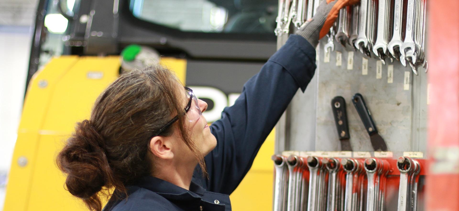 Motive Power student selecting a wrench