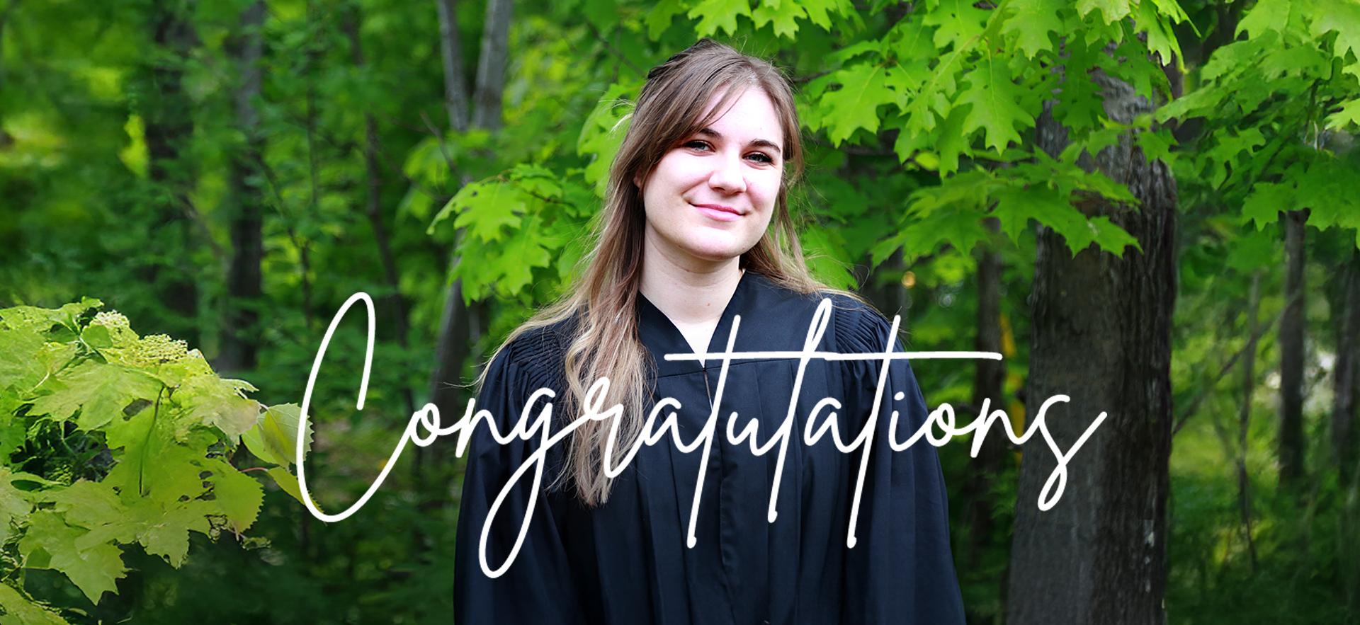 Graduate in gown with trees behind smiling at camera with Congratulations text overlay