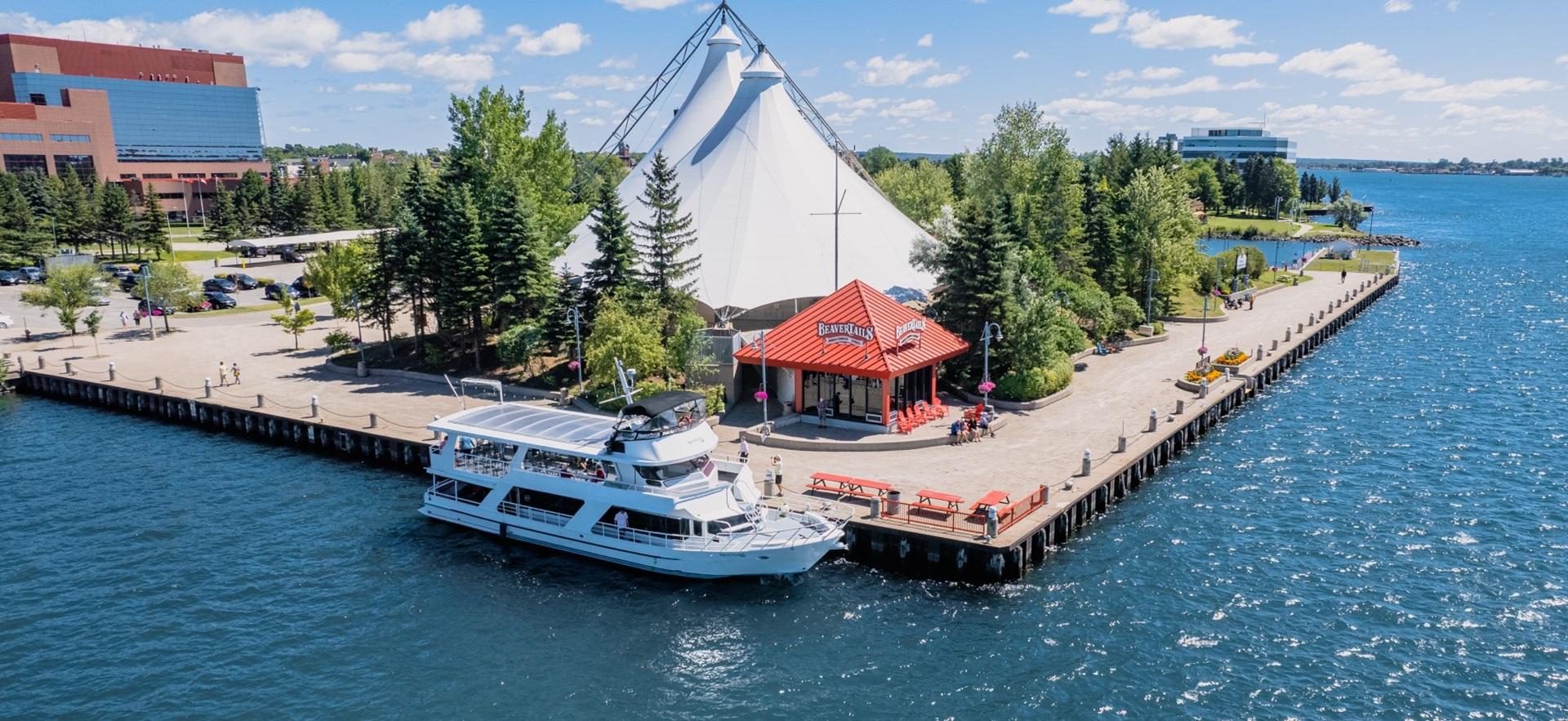 Waterfront with pavilion, Beaver Tails and Miss Marie around the boardwalk
