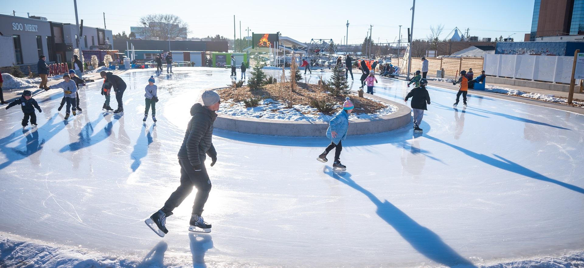 People skating on a sunny winter day at Downtown Plaza
