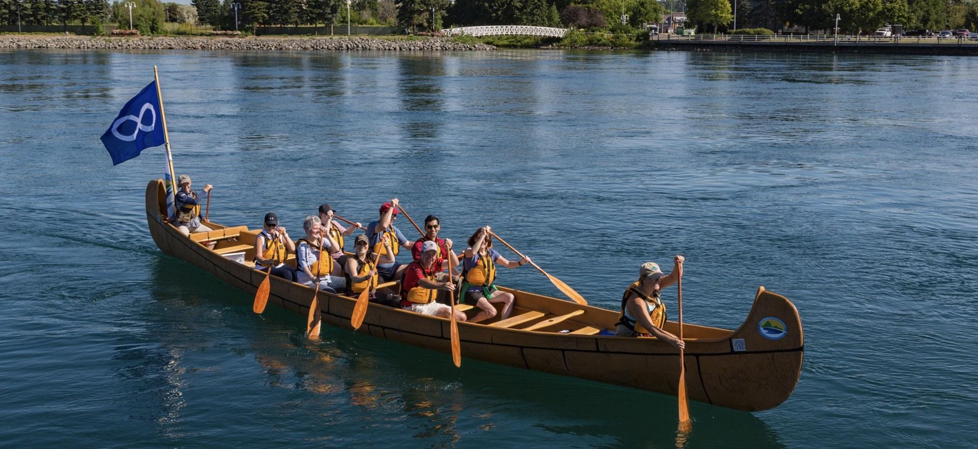 Metis Tours with a group canoeing on the water