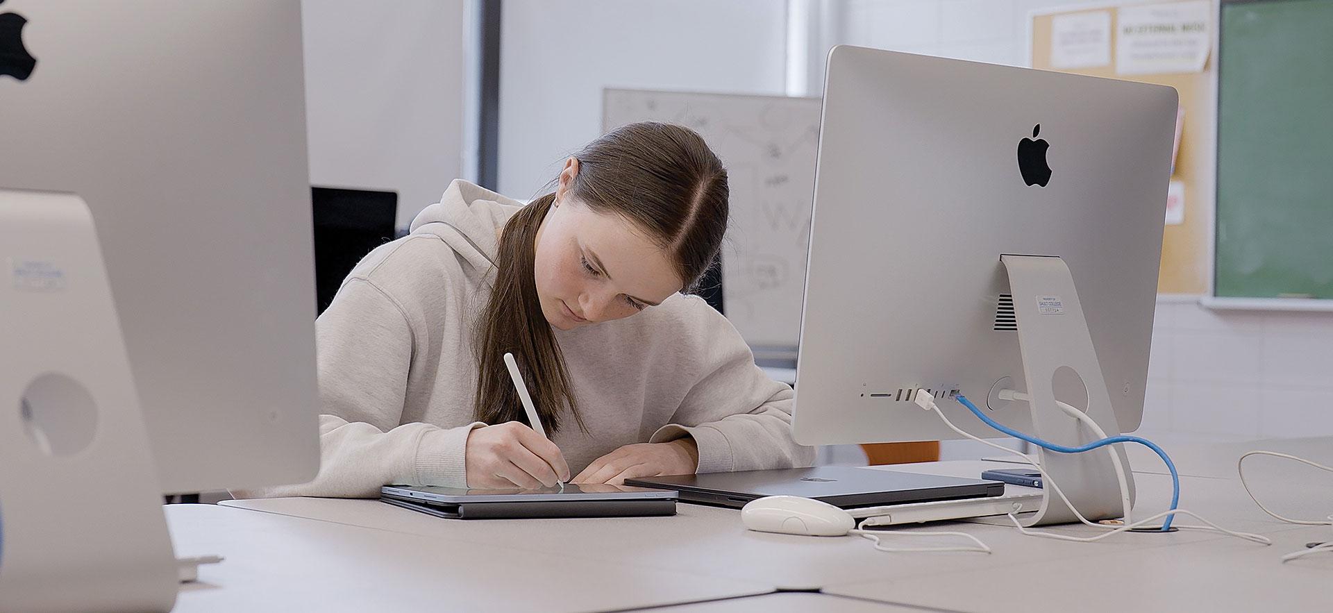 Graphic Design student using tablet to design 