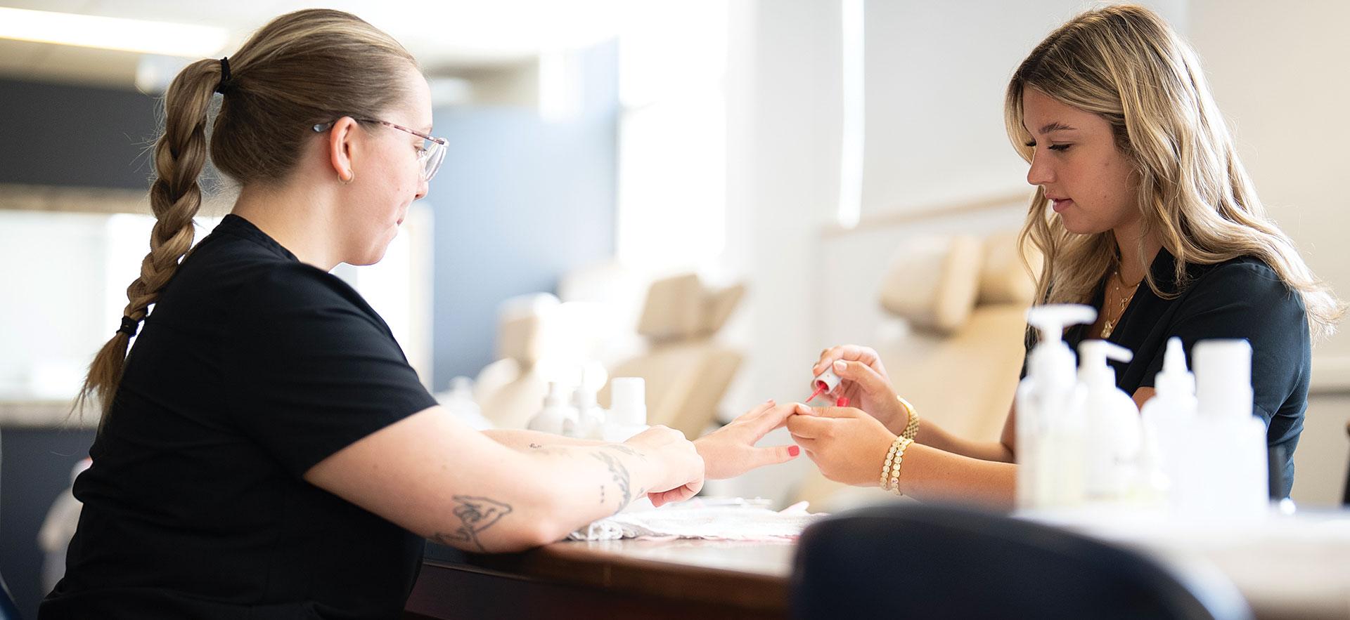 Student in spa working with student nails