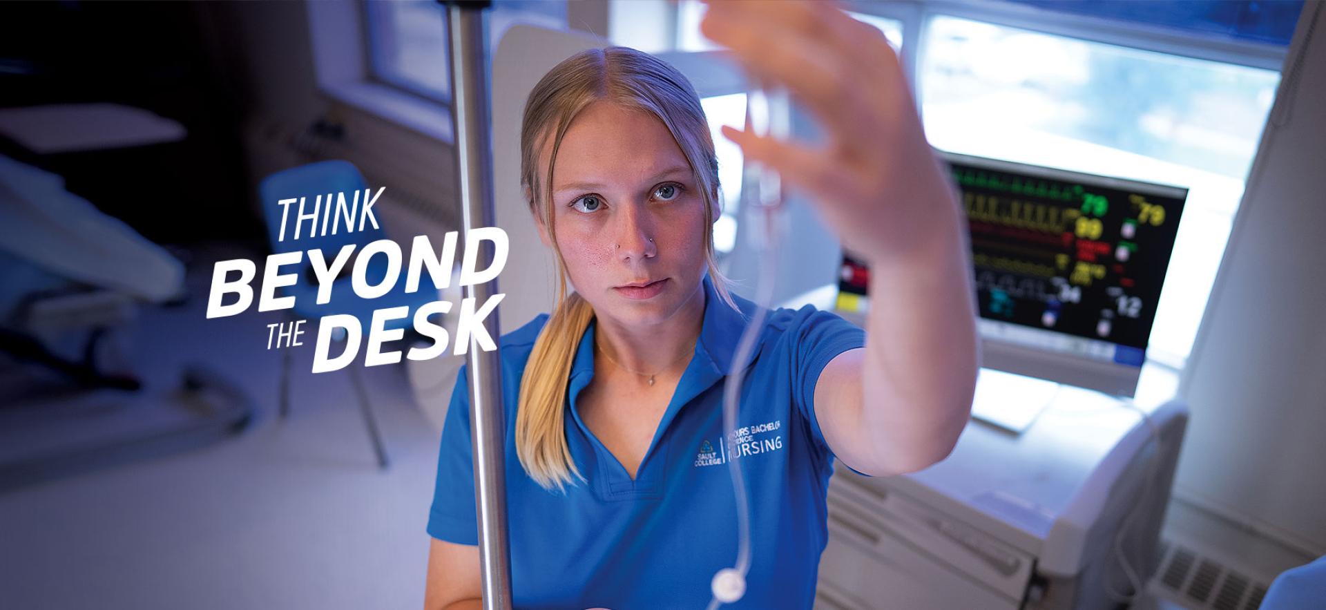 Student nurse checking IV