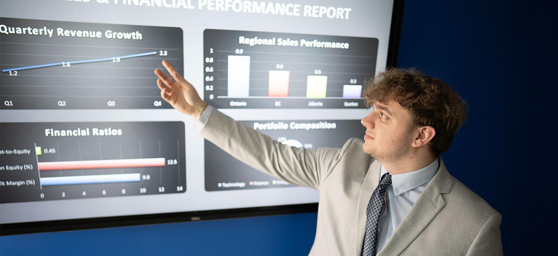 Business student pointing to accounting presentation