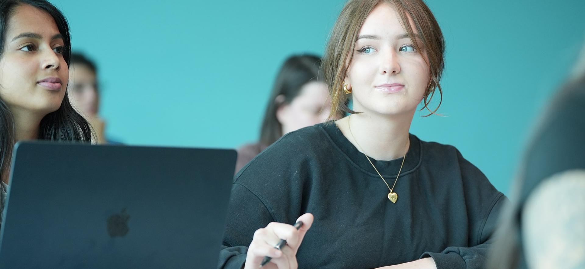 Student sitting in classroom looking to the side