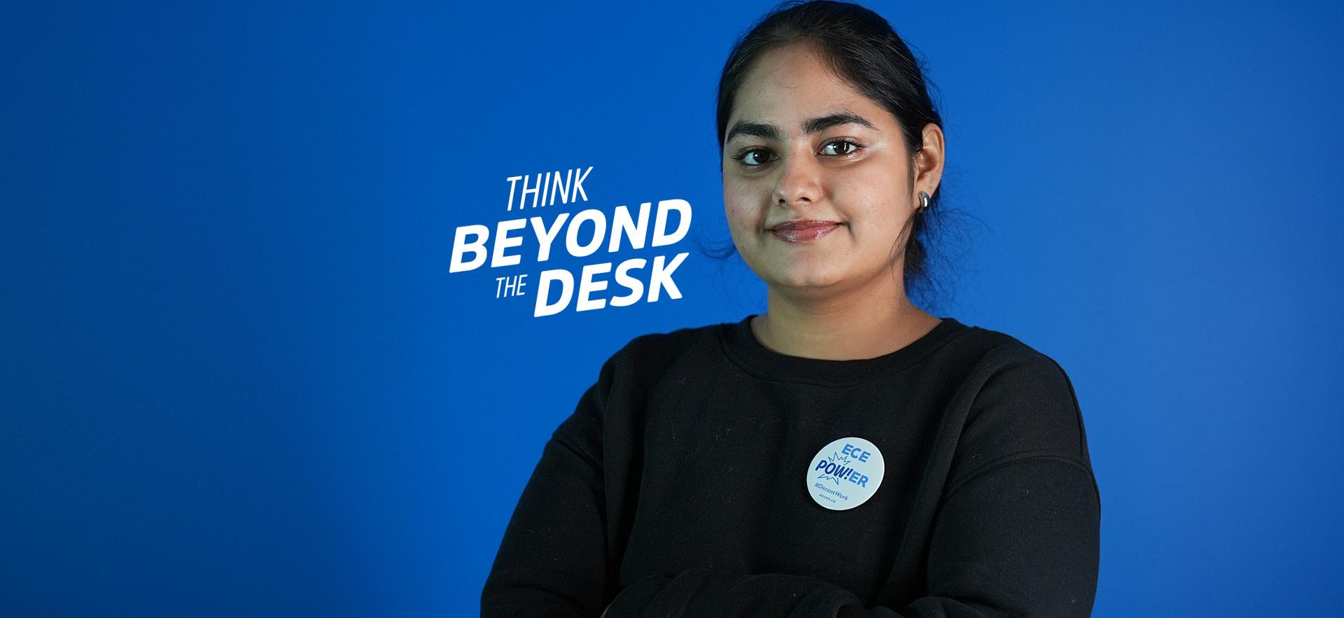 ECE student looking at camera with arms crossed