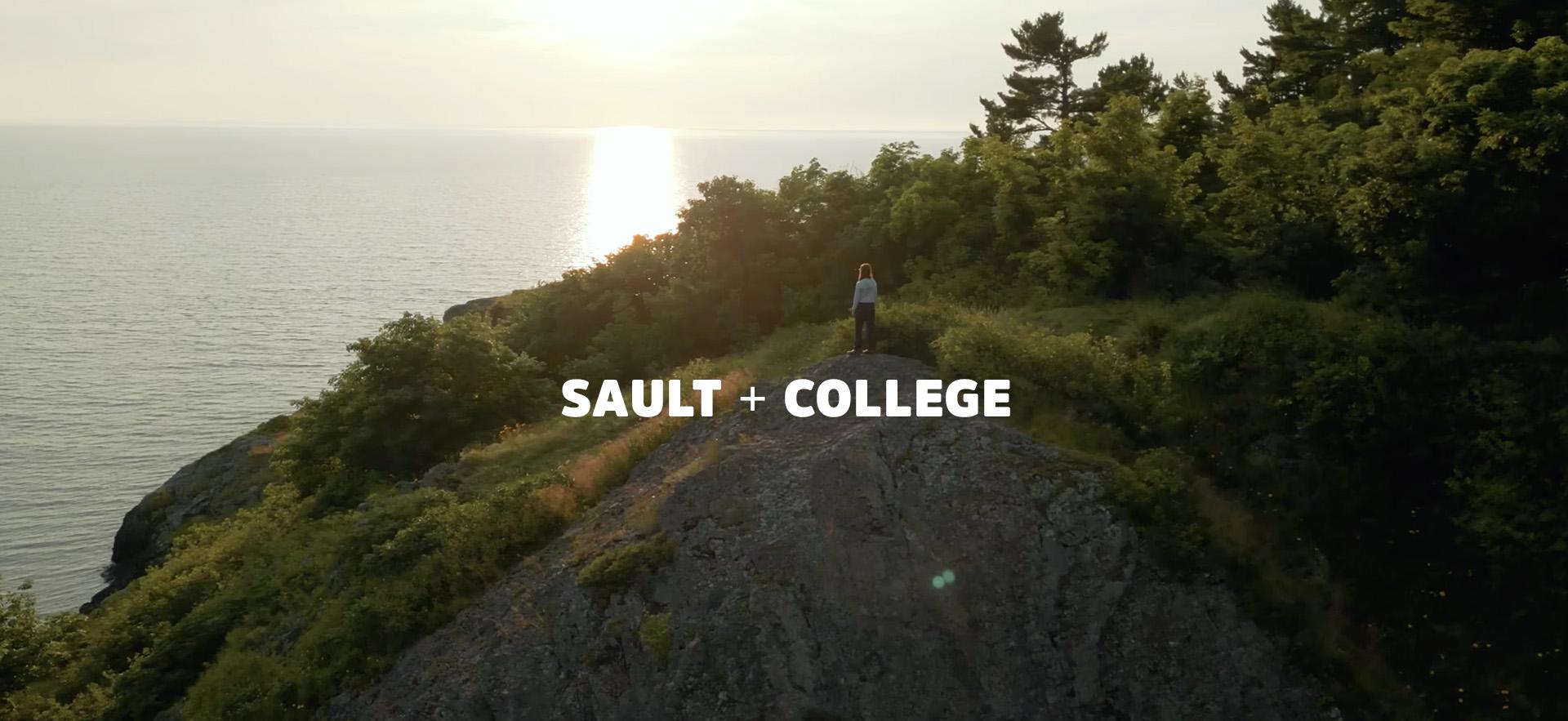 sun setting in background with person on cliff overlooking water with Sault + College text overlay