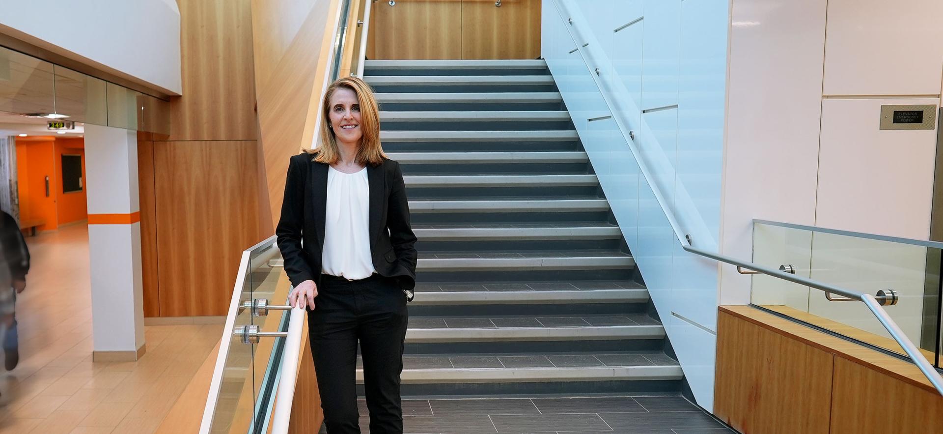 Image of Sherri Smith standing on stairs 