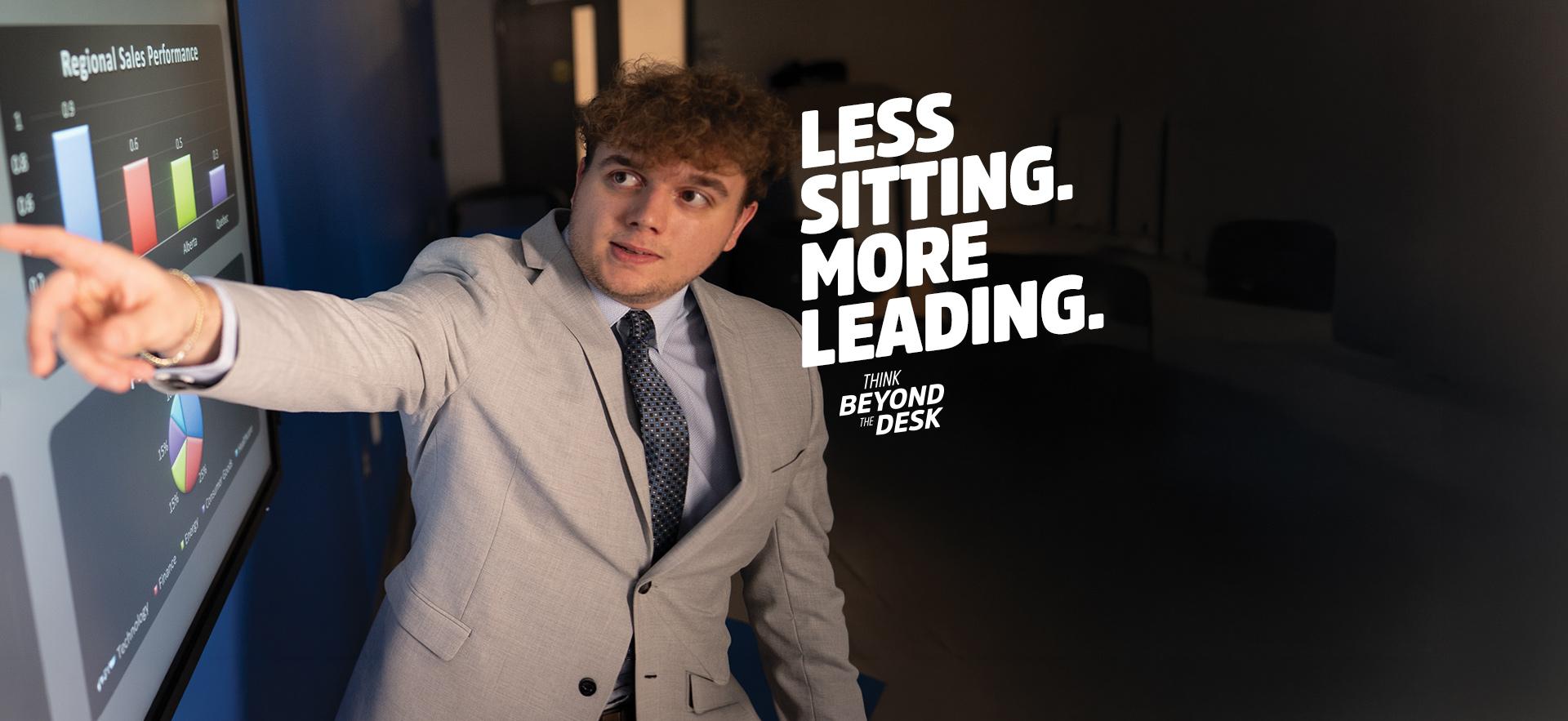 Business student pointing to accounting presentation