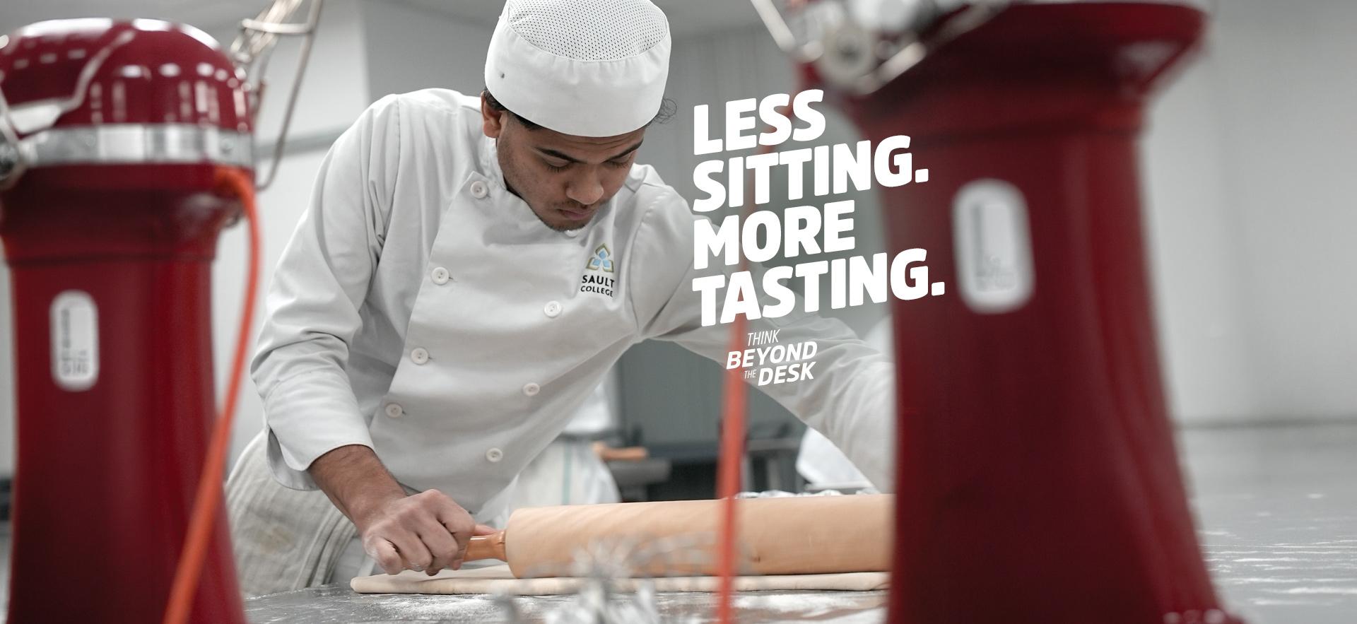Culinary student rolling out dough in baking lab