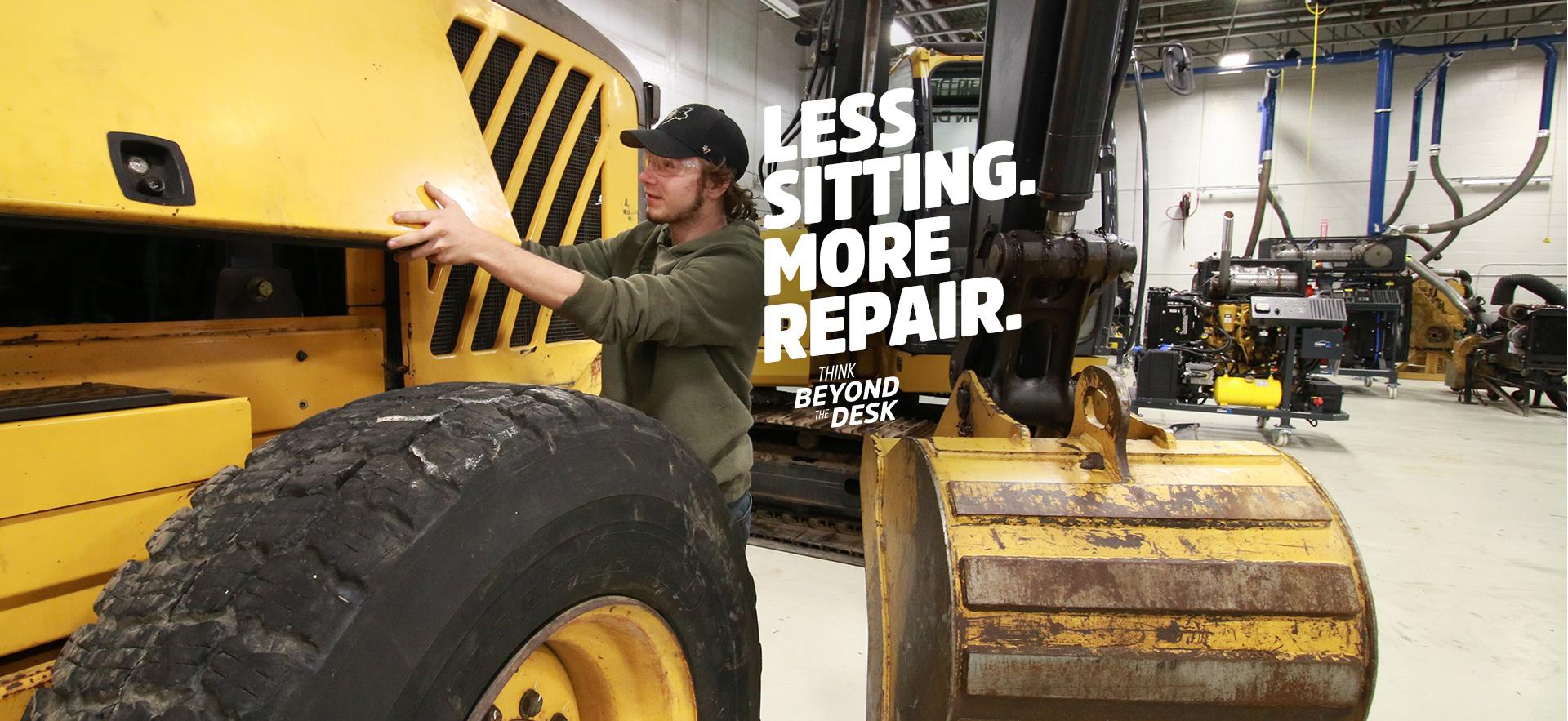 Motive Power student working on heavy equipment in the lab
