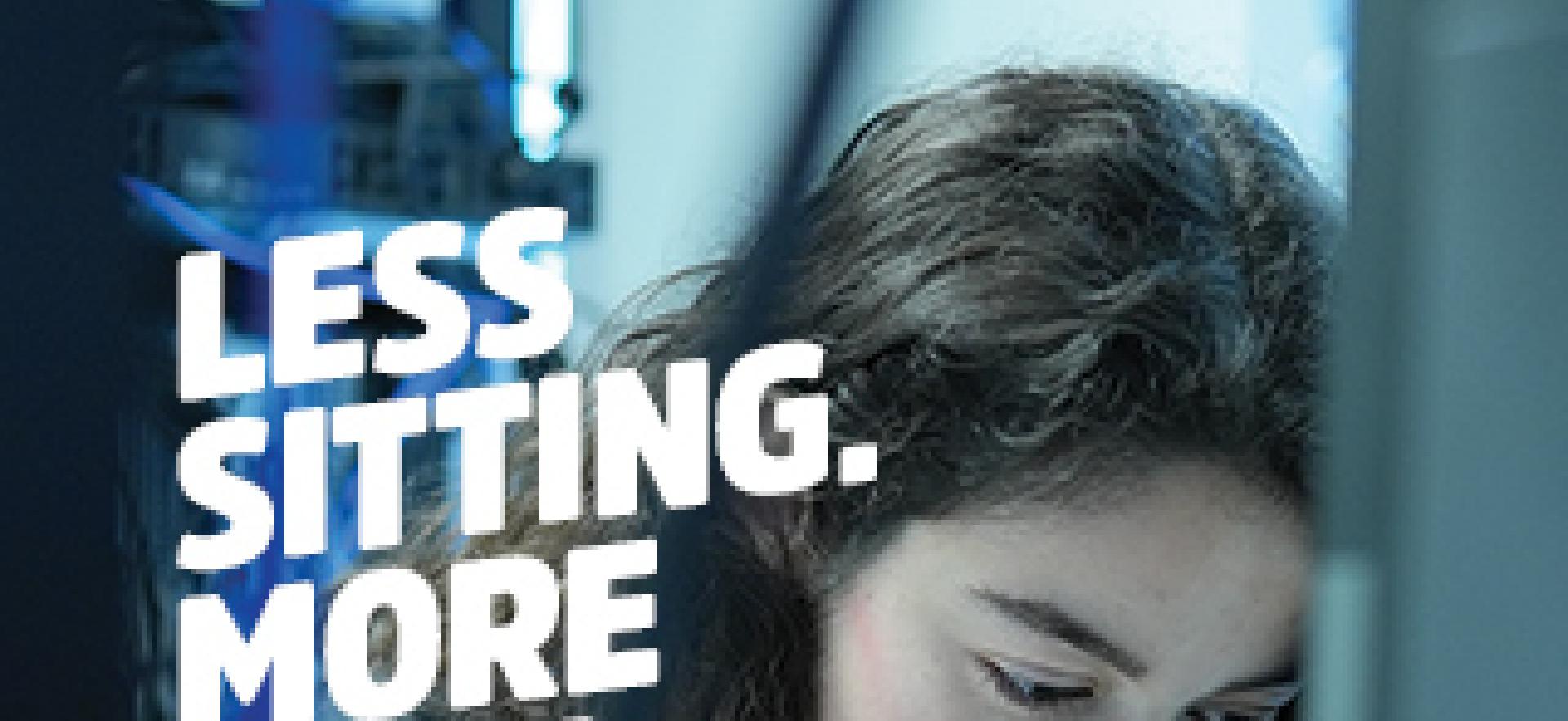 IT student standing and leaning over computer at networking stacks