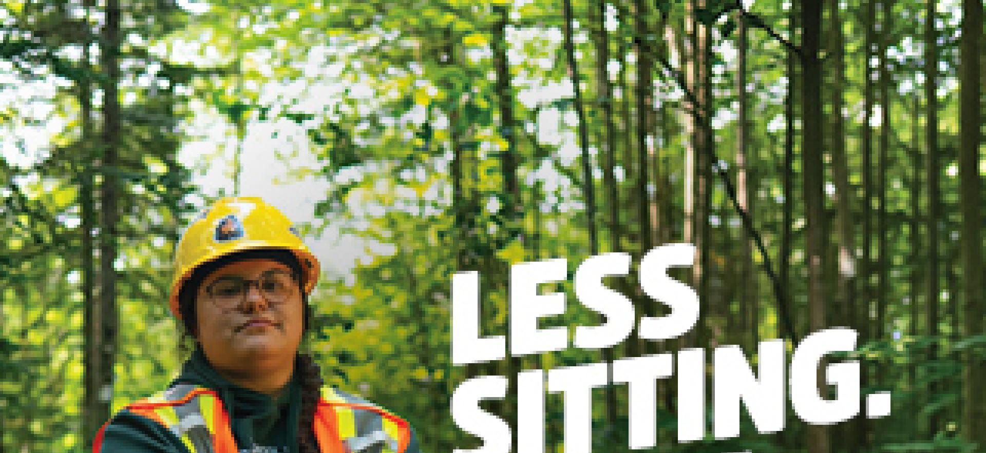 Natural Environment student leaning against blue desk in outdoor lab