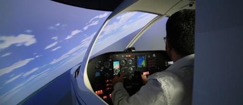 Male student in flight simulator.